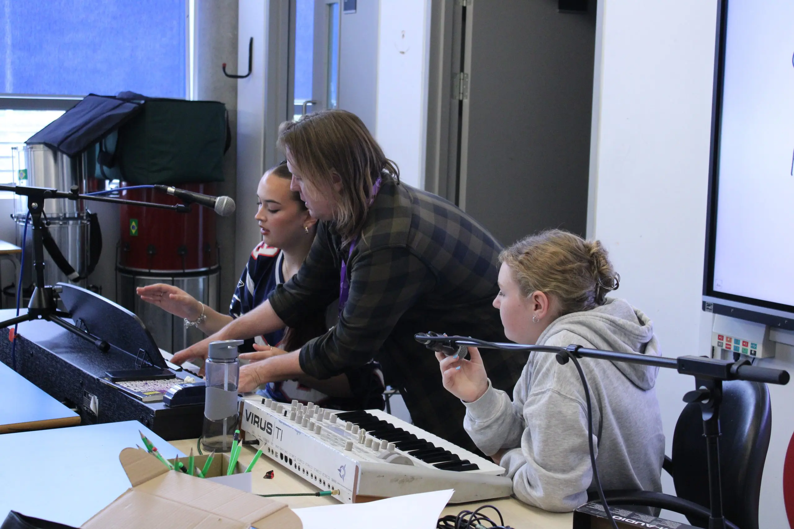 Male tutor teaching music production in the Folkestone Music Lab