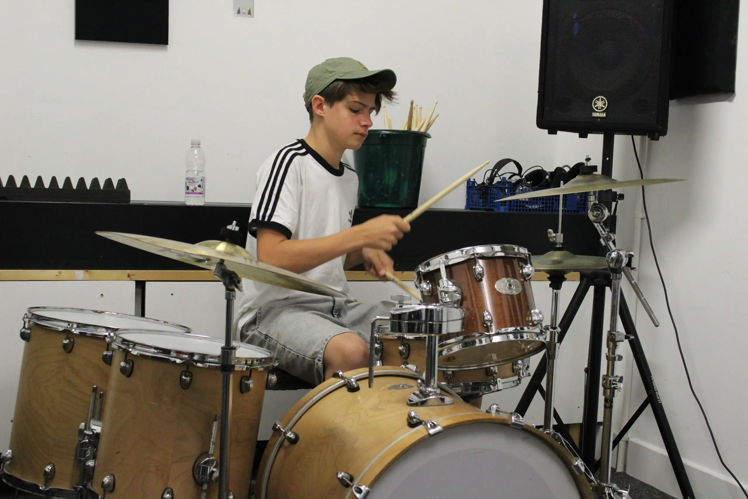 Boy learning to play the drums in Folkestone Music Lab
