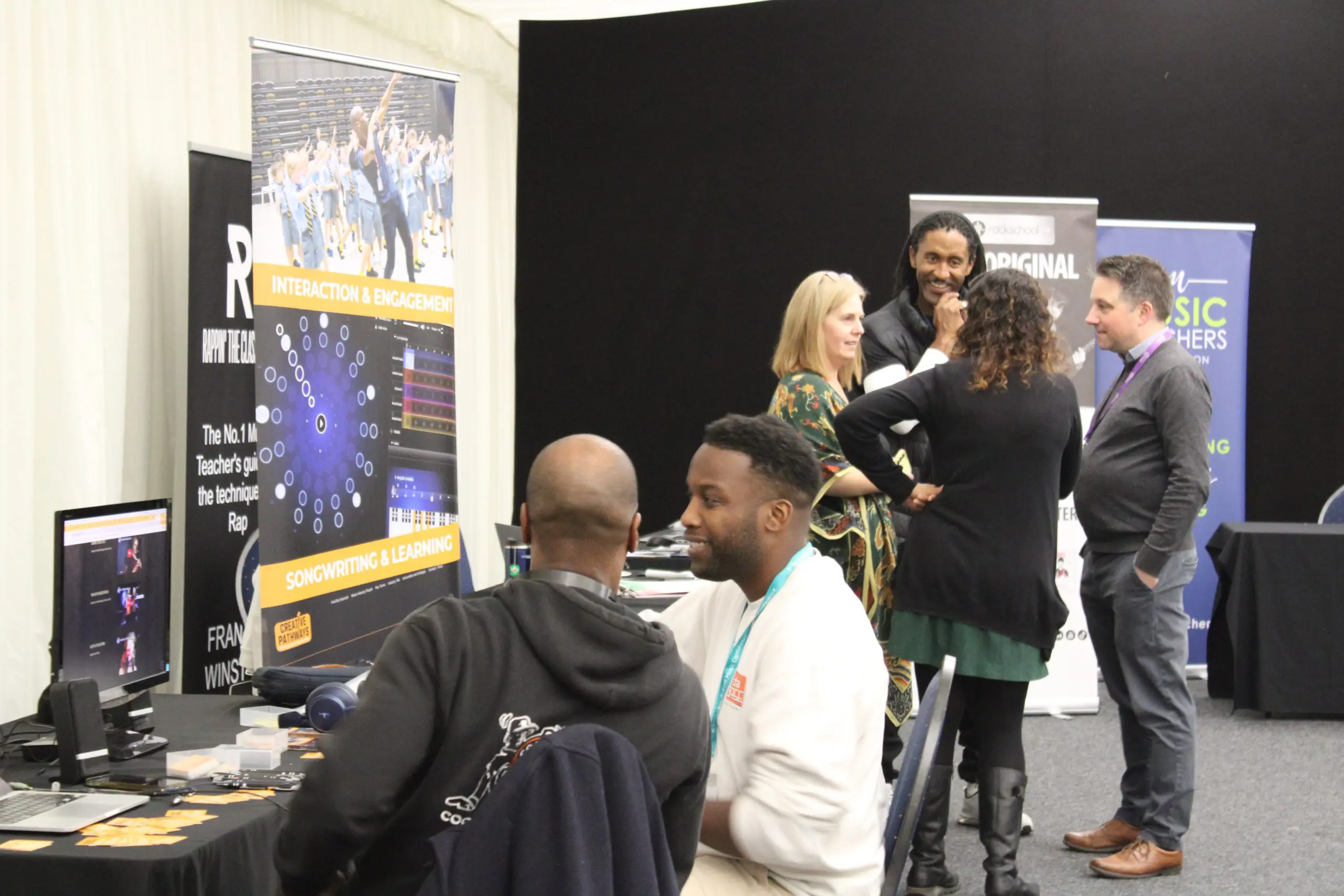 People engaging in activities at the Kent and Medway Conference for Kent Music