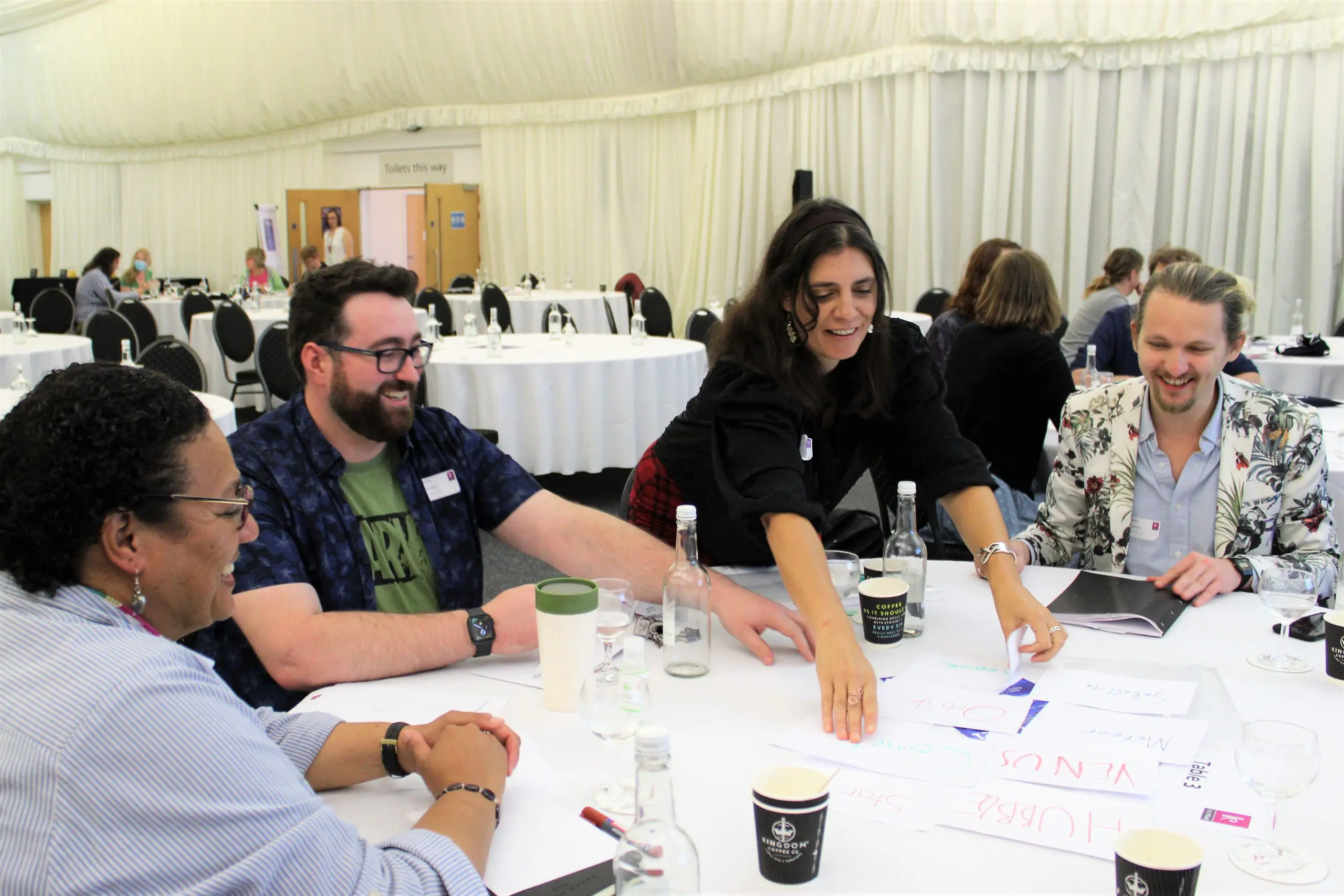 A group of teachers sat around a table at a training day